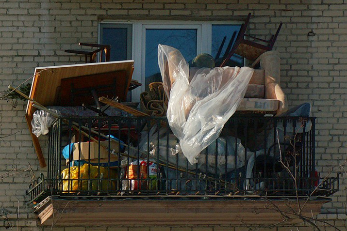 A photo of a balcony full of rubbish
