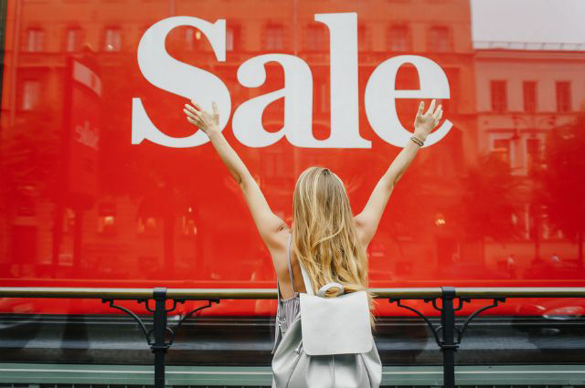 A colorful photo of a real estate agent getting excited about the sucessful property sale